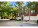 View of the townhouse complex featuring well-manicured greenery and inviting facades at 2108 Waters Edge Trl, Roswell, GA 30075