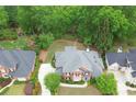 Beautiful home in a lush, green neighborhood with mature trees and well-maintained lawns at 9175 Etching Overlook, Johns Creek, GA 30097