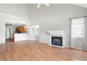 Spacious living room featuring hardwood floors, a fireplace, and plenty of natural light at 1034 Hillsborough Nw, Kennesaw, GA 30144