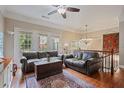 Cozy living room with hardwood floors, large windows, comfortable seating, and natural light at 2268 Limehurst Ne Dr # 120, Atlanta, GA 30319