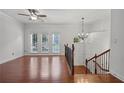 Spacious living room with hardwood floors, ceiling fan, and large windows providing natural light at 2268 Limehurst Ne Dr # 120, Atlanta, GA 30319