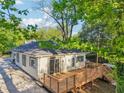 Backyard view showcasing a wooden deck perfect for outdoor entertaining, complemented by mature trees at 39 Wyman Se St, Atlanta, GA 30317