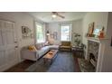 Bright living room with a fireplace, a stylish rug, and comfortable seating arrangements at 2881 Parrott Nw Ave, Atlanta, GA 30318