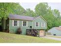 Well-maintained two-story home featuring an attached two-car garage and cozy front porch at 3785 Willow Ridge Rd, Douglasville, GA 30135