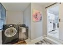 Convenient laundry room with modern washer and dryer, plus stylish decor at 1626 Oak Knoll Se Cir, Atlanta, GA 30315