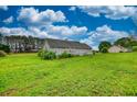 Expansive backyard with lush green grass, providing a serene and private outdoor space at 2068 Hampton Locust Grove Rd, Locust Grove, GA 30248
