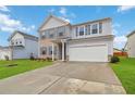 Beautiful two-story home with a two-car garage, large driveway, well-manicured lawn, and attractive curb appeal at 340 Paulownia Cir, Mcdonough, GA 30253