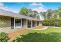 Well-maintained home exterior with a green lawn and inviting front porch at 620 Clearbrook Ct, Marietta, GA 30068