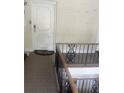 Close up of a charming entry way with a staircase with decorative iron railings at 750 Dalrymple Rd # G3, Atlanta, GA 30328