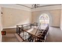 Inviting entryway featuring a staircase with decorative iron railings and a window with natural light at 750 Dalrymple Rd # G3, Atlanta, GA 30328