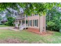 A well-maintained two-story home with a manicured lawn and fresh landscaping at 1912 Riverton Dr, Suwanee, GA 30024
