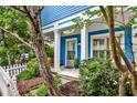 Inviting front porch with blue siding, white trim, and a cozy swing at 318 Glenwood Se Ave, Atlanta, GA 30312