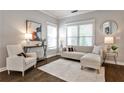 Bright living room with hardwood floors, neutral furniture, and ample natural light at 318 Glenwood Se Ave, Atlanta, GA 30312