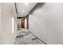 Neutral colored hallway features textured walls, patterned carpet, recessed lighting and dark doors at 400 W Peachtree Nw St # 3614, Atlanta, GA 30308