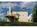View of the rear exterior showcasing a deck and the home's siding at 981 Charles Hall Dr, Dacula, GA 30019