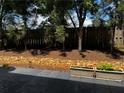 Stone and mulch accents adorn the backyard, creating a harmonious and relaxing outdoor setting at 4858 Stratford Ln, Johns Creek, GA 30022