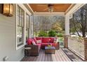 Cozy front porch featuring comfortable seating, outdoor decor, and views of the landscaped yard at 958 Austin Ne Ave, Atlanta, GA 30307