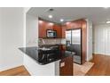 Modern kitchen with stainless steel appliances, granite countertops, and ample cabinet space at 1261 Caroline Street Ne # 206, Atlanta, GA 30307