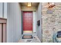 Inviting front door with stone accents and a 'welcome' mat at 1205 Druid Knoll Ne Dr, Brookhaven, GA 30319