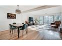 Spacious living room and dining area features hardwood floors, neutral paint, and sliding glass door at 1205 Druid Knoll Ne Dr, Brookhaven, GA 30319