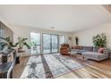 Bright living room with hardwood floors, large windows, and stylish furnishings at 1205 Druid Knoll Ne Dr, Brookhaven, GA 30319