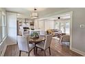 Open-concept living space with a dining area, kitchen island, and a sitting area with natural light at 217 Penelope Nw Dr, Atlanta, GA 30314