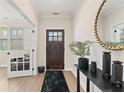 Elegant foyer with hardwood floors, stylish decor, and a view of the adjacent living space at 3672 Silvery Way, Powder Springs, GA 30127
