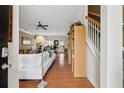 Inviting entryway with hardwood floors, staircase, and view into the open-concept living area at 2229 Polder Way, Austell, GA 30168