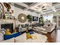 Cozy living room with a fireplace, stylish decor, and hardwood floors at 2404 Fitts Dr, Conyers, GA 30094