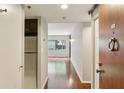 Inviting hallway with hardwood floors leading to a bright living space at 1130 Piedmont Ne Ave # 410, Atlanta, GA 30309