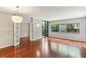 Spacious living room featuring gleaming hardwood floors and ample natural light at 1130 Piedmont Ne Ave # 410, Atlanta, GA 30309