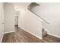 Inviting entryway with hardwood floors and staircase to the upper level at 1881 Millstream Holw, Conyers, GA 30012