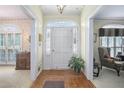 Bright foyer featuring hardwood floors, classic architectural details, and a traditional design at 4066 Brymond Ct, Tucker, GA 30084