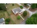 Aerial view of a home with a large yard, surrounded by lush greenery in a peaceful neighborhood at 25 Oakbrook Ln, Covington, GA 30016