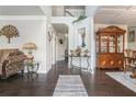 Inviting foyer with hardwood floors and elegant decor, showcasing the home's open floor plan at 3399 In Bloom Way, Auburn, GA 30011