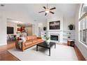 Bright living room with a fireplace, built-in bookshelves, and a tan leather sofa at 2061 Grove Field Lane #13, Marietta, GA 30064