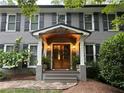Close up of the front porch showcasing the door and decorative plants at 4586 Smoke Rise Ln, Marietta, GA 30062