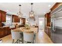 Gourmet kitchen with custom cabinets, granite counters, stainless steel appliances, and a large center island at 4586 Smoke Rise Ln, Marietta, GA 30062