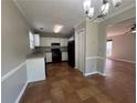 Eat-in kitchen featuring black appliances, neutral walls, updated granite countertops, and tile flooring at 4081 Liberty Hill Dr, Norcross, GA 30093