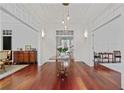 Bright foyer with hardwood floors, elegant lighting, and views into adjacent rooms at 4356 N Buckhead Ne Dr, Atlanta, GA 30342