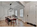 Bright dining room showcases hardwood floors, modern lighting, and an inviting space for meals and relaxation at 4391 Encore Blvd, Duluth, GA 30097
