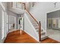 Spacious foyer with hardwood floors and a staircase leading to the second level at 1145 Cool Springs Nw Dr, Kennesaw, GA 30144