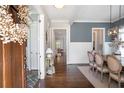Elegant foyer with hardwood floors, white trim, and a view into the dining room at 3042 Jefferson St, Atlanta, GA 30341