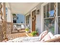 Inviting front porch featuring a swing, seating, and a decorative wreath on the wooden front door at 3042 Jefferson St, Atlanta, GA 30341