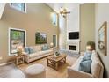 Bright living room with high ceilings, a fireplace, and comfortable seating perfect for relaxation and entertaining at 1745 Fairburn Dr, Cumming, GA 30040