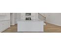 Modern kitchen featuring white cabinets, granite countertops, and stainless steel appliances at 853 Pensive Run, Dacula, GA 30019