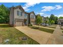 Attractive townhome with a well-maintained lawn and private driveway at 255 Skipjack Ct, Covington, GA 30016