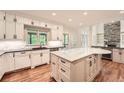Modern kitchen with white cabinets, a large island, and stainless steel appliances at 3801 Bays Ferry Trl, Marietta, GA 30062