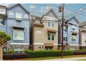 Well-maintained townhome showcases an inviting facade with beautiful curb appeal at 569 Mirrormont Se Dr, Smyrna, GA 30080