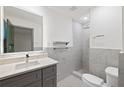 Updated bathroom with marble-look tiling, sleek vanity, and glass enclosed shower at 3471 Elgin Dr, Decatur, GA 30032